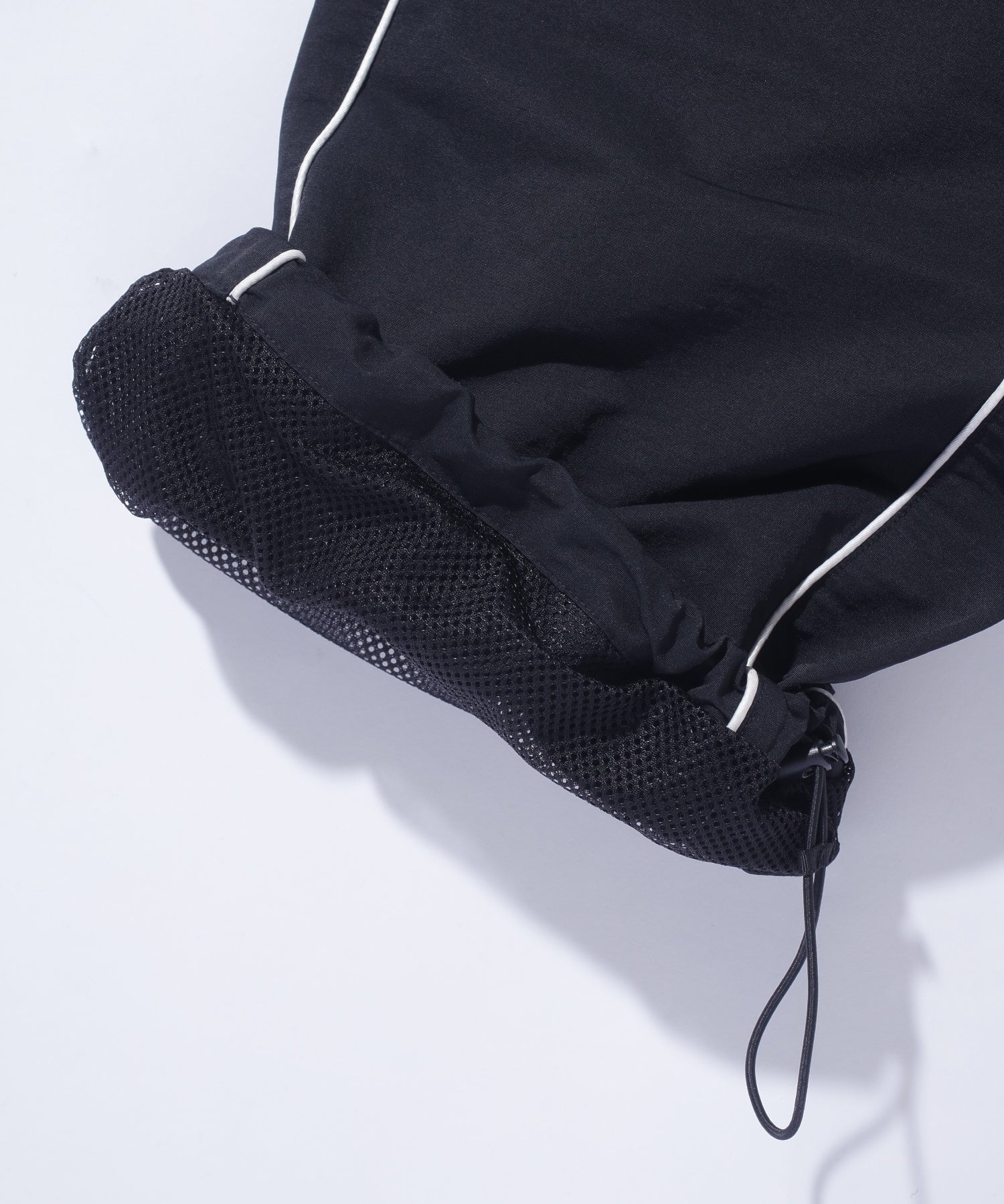 CURVED NYLON PANTS