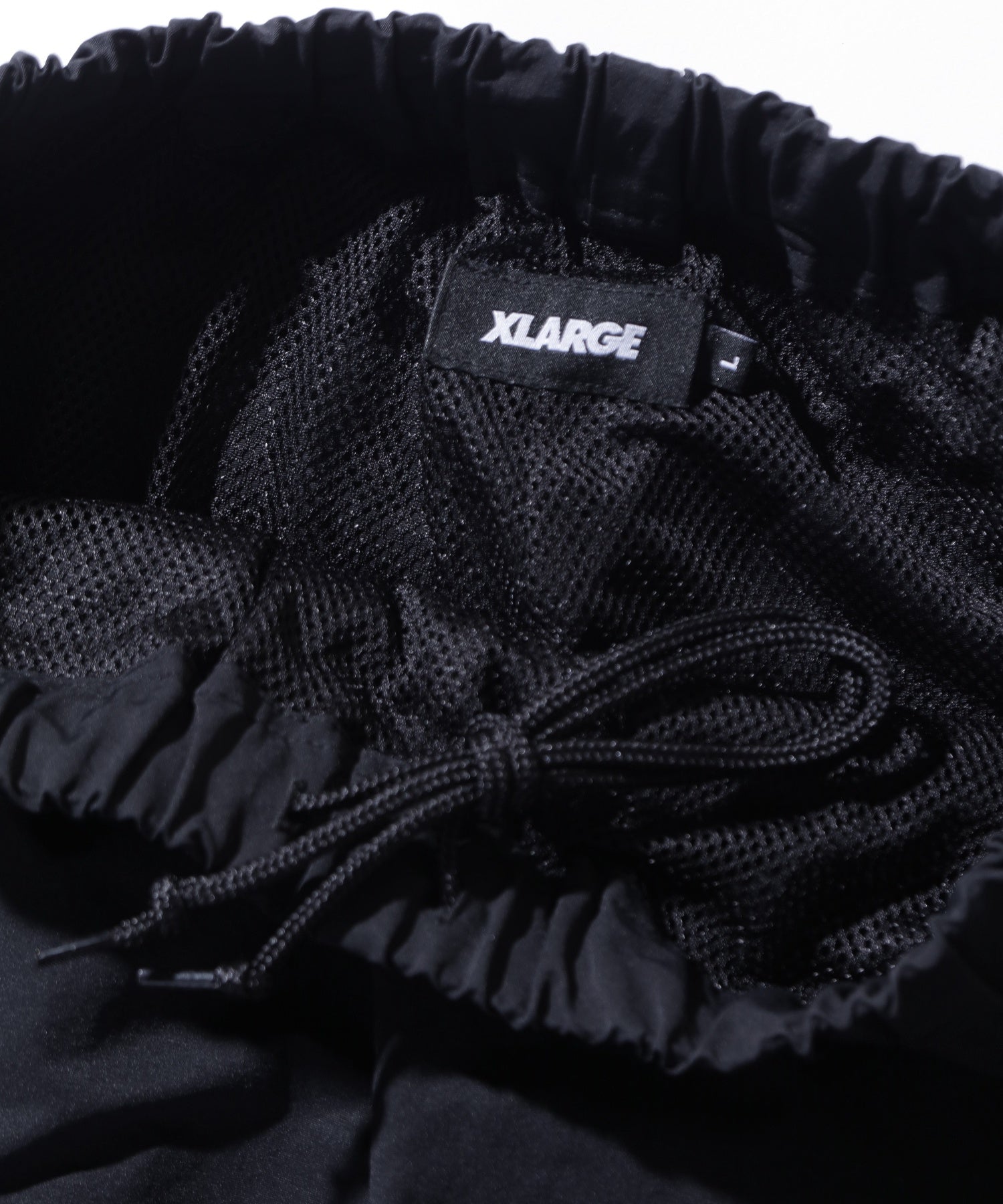 CURVED NYLON PANTS