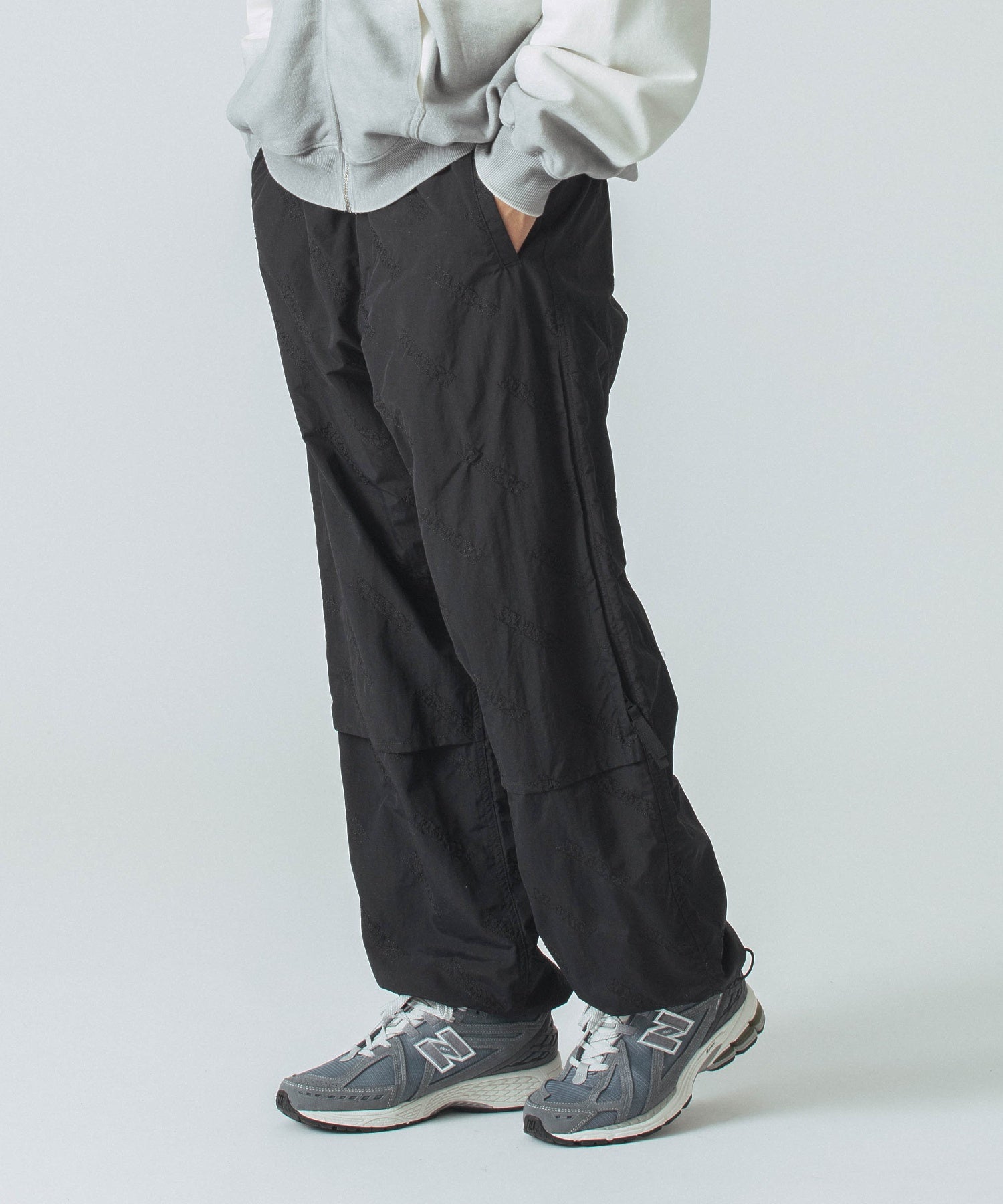 ALLOVER LOGO PATTERN EMBROIDERED NYLON PANTS