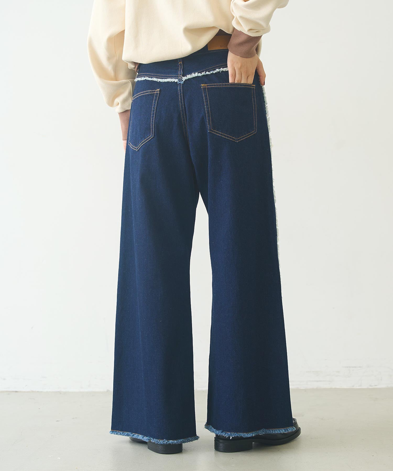 FRINGE DENIM PANTS