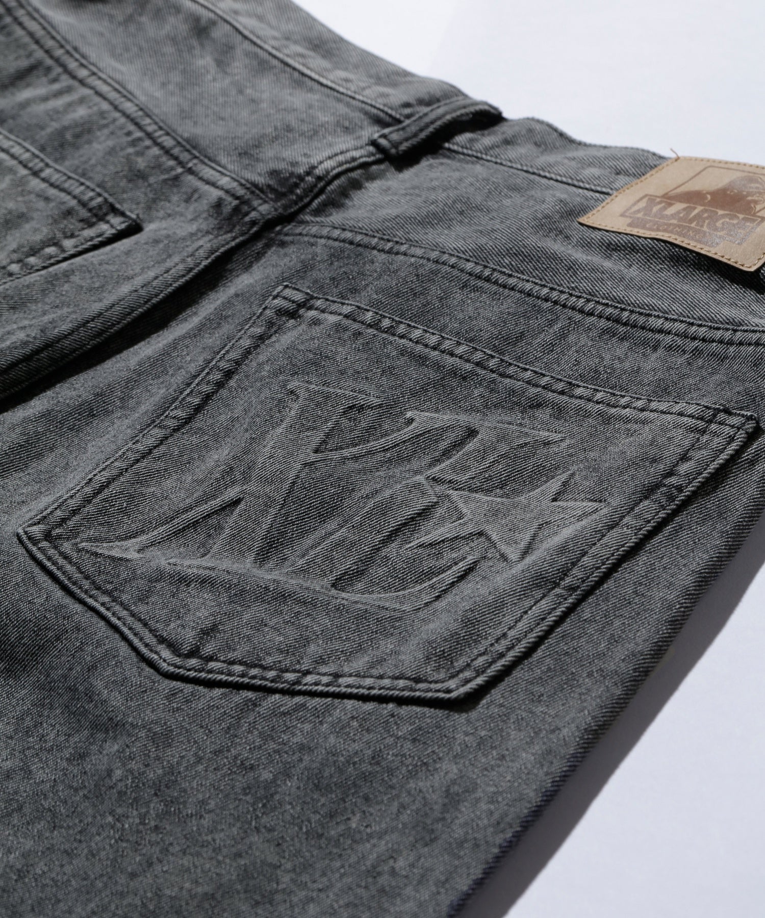 EMBOSSED DENIM PANTS