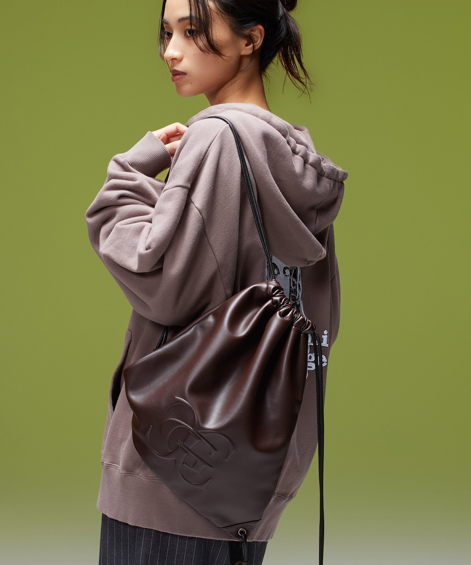 XG EMBLEM FAUX LEATHER KNAPSACK