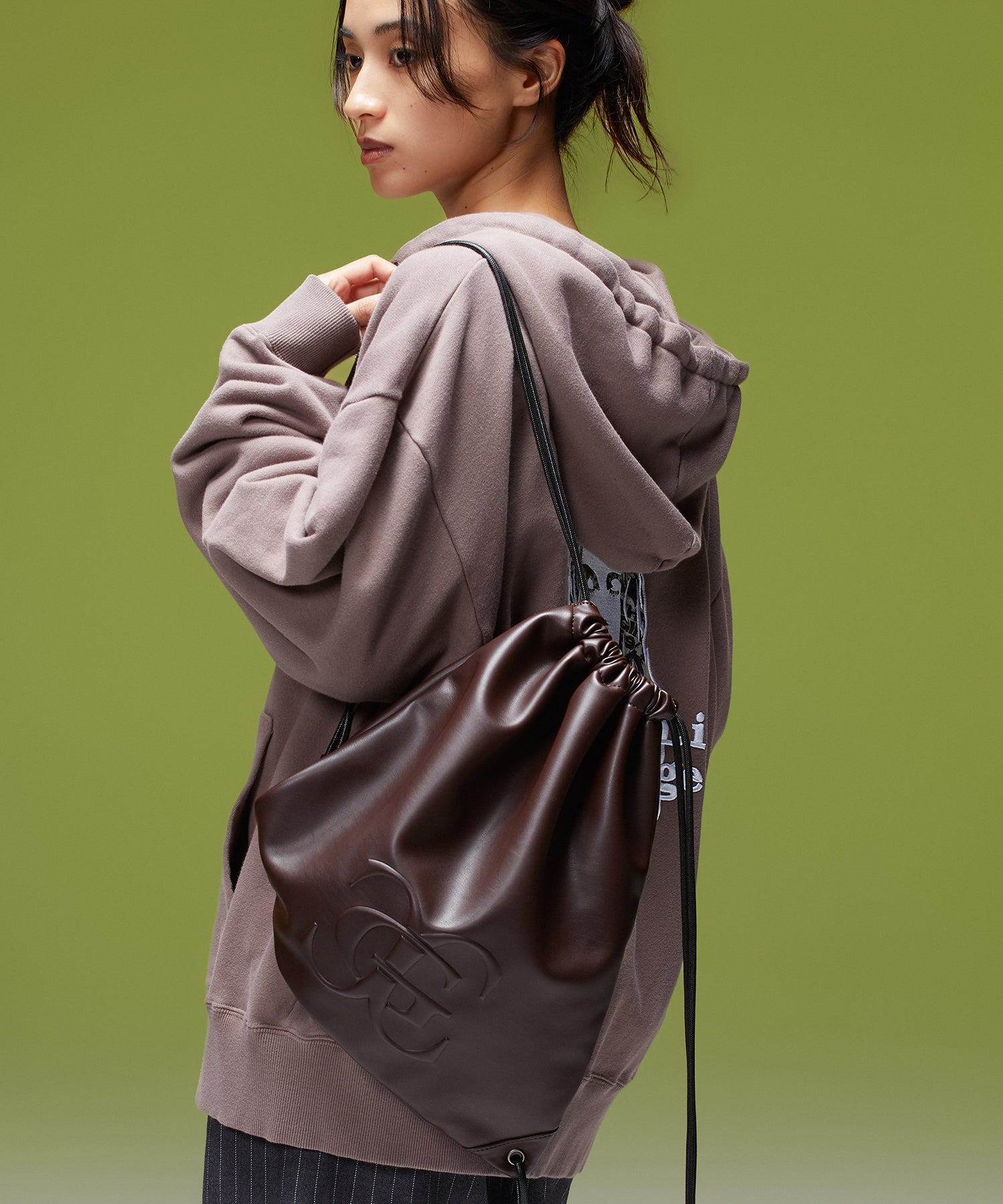 XG EMBLEM FAUX LEATHER KNAPSACK