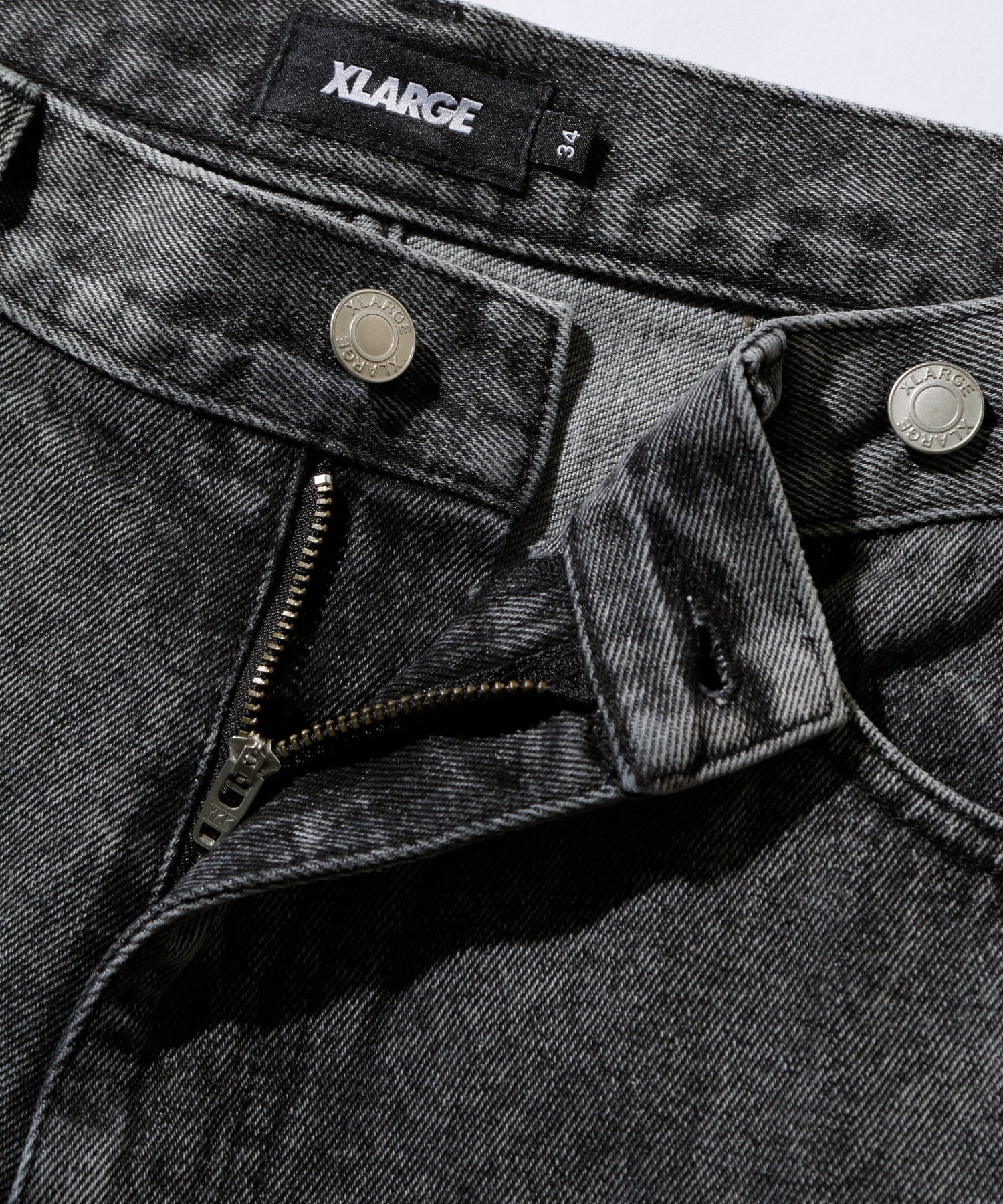 EMBOSSED DENIM PANTS