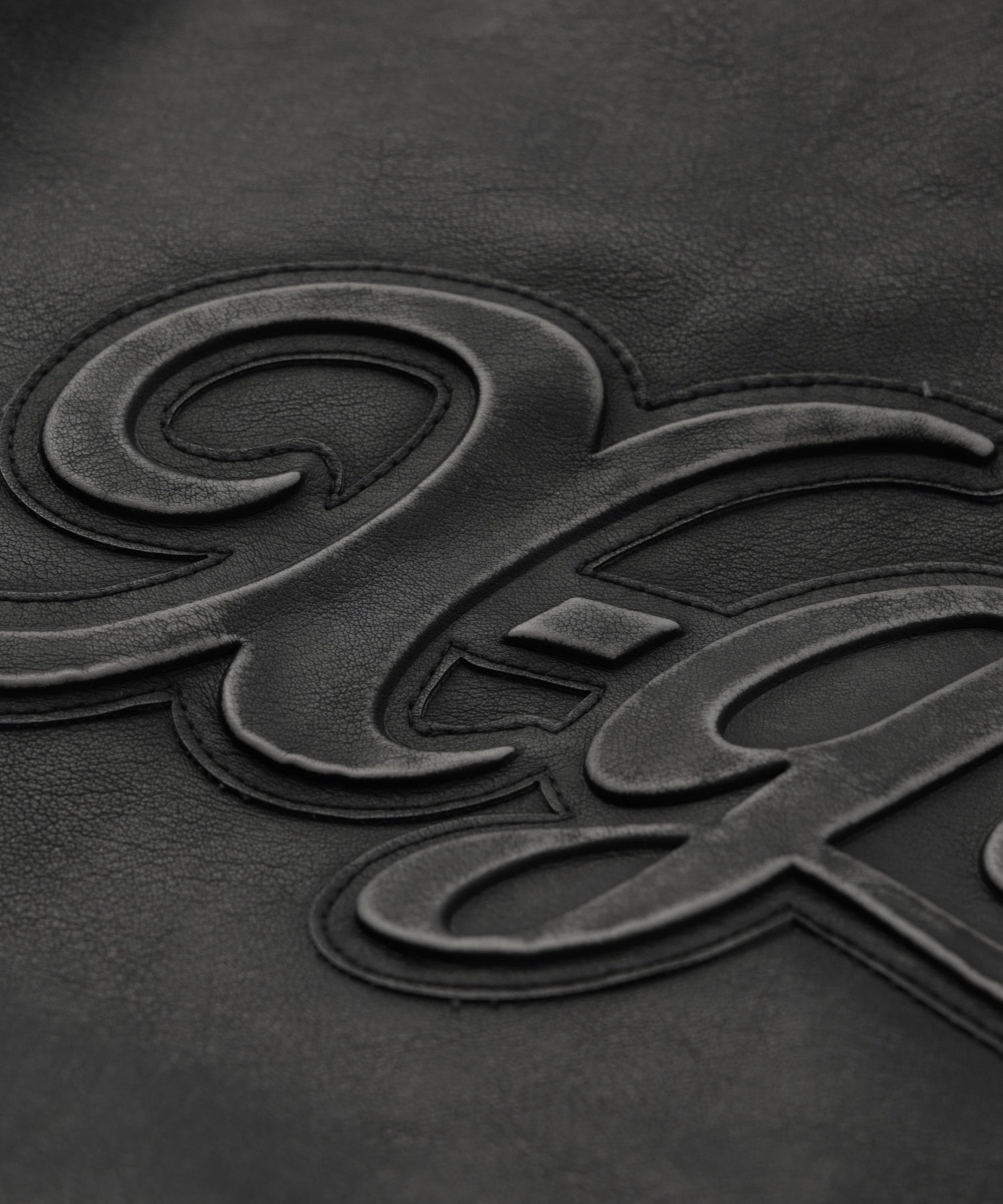 EMBOSSED LOGO PATCH DISTRESSED FAUX LEATHER JACKET