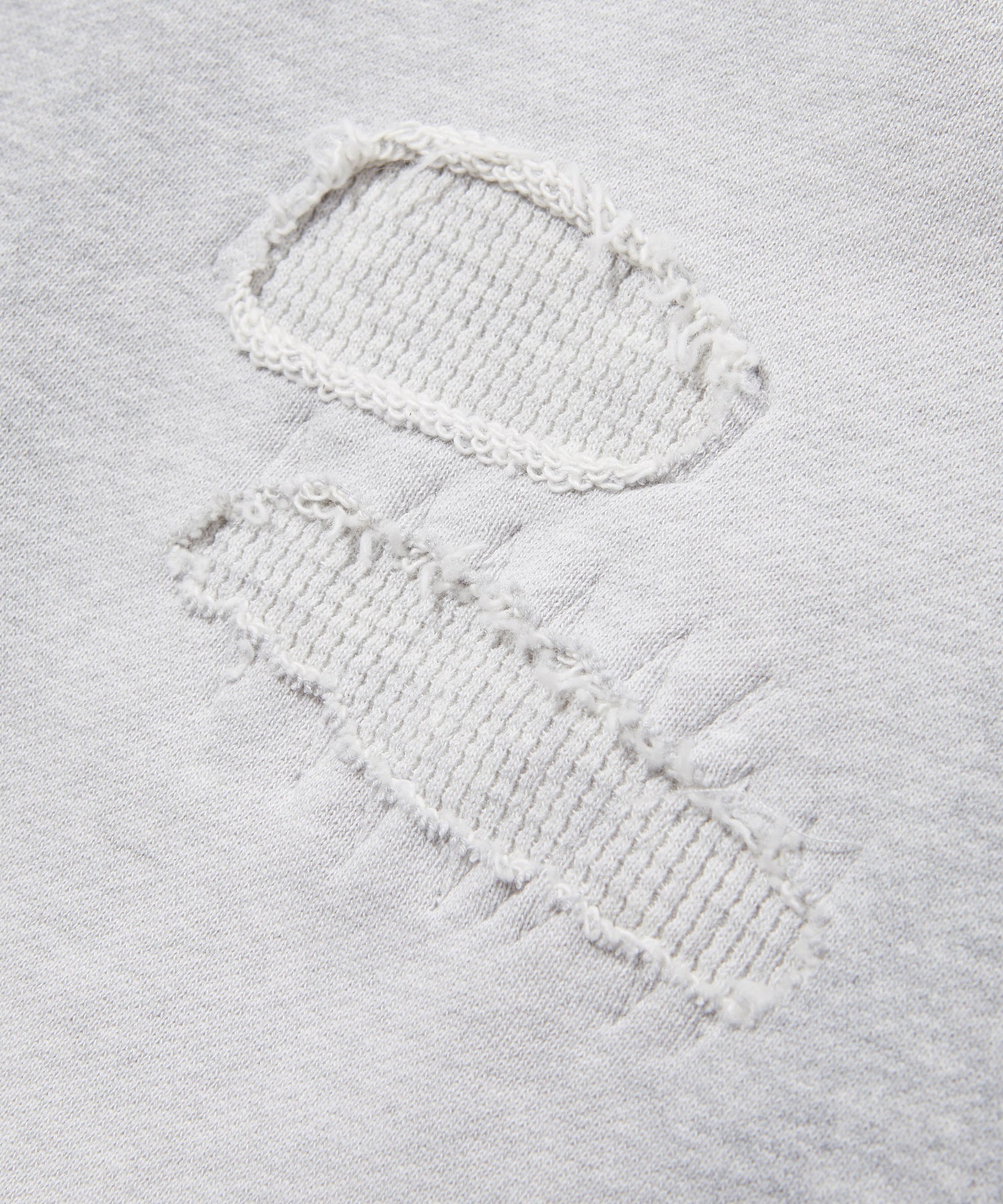 LAYERED DISTRESSED SWEATPANTS