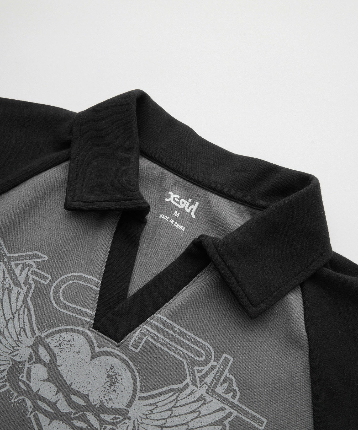 HEART AND WING LOGO RAGLAN POLO TOP