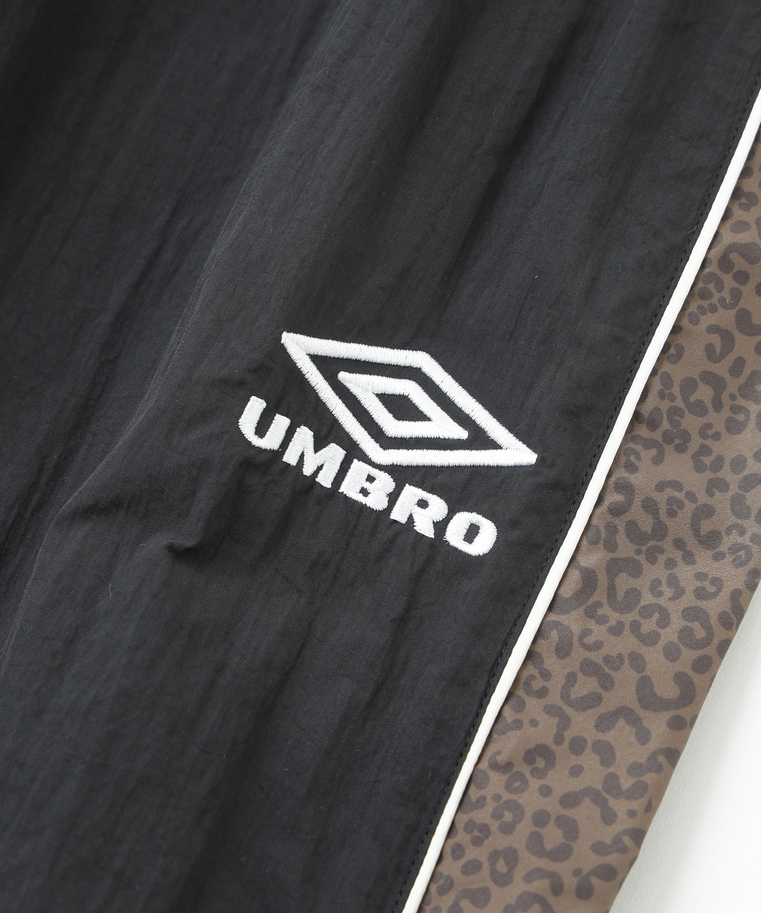 UMBRO×ROSE BUD/LEOPARD PATTERN LINE NYLON PANTS