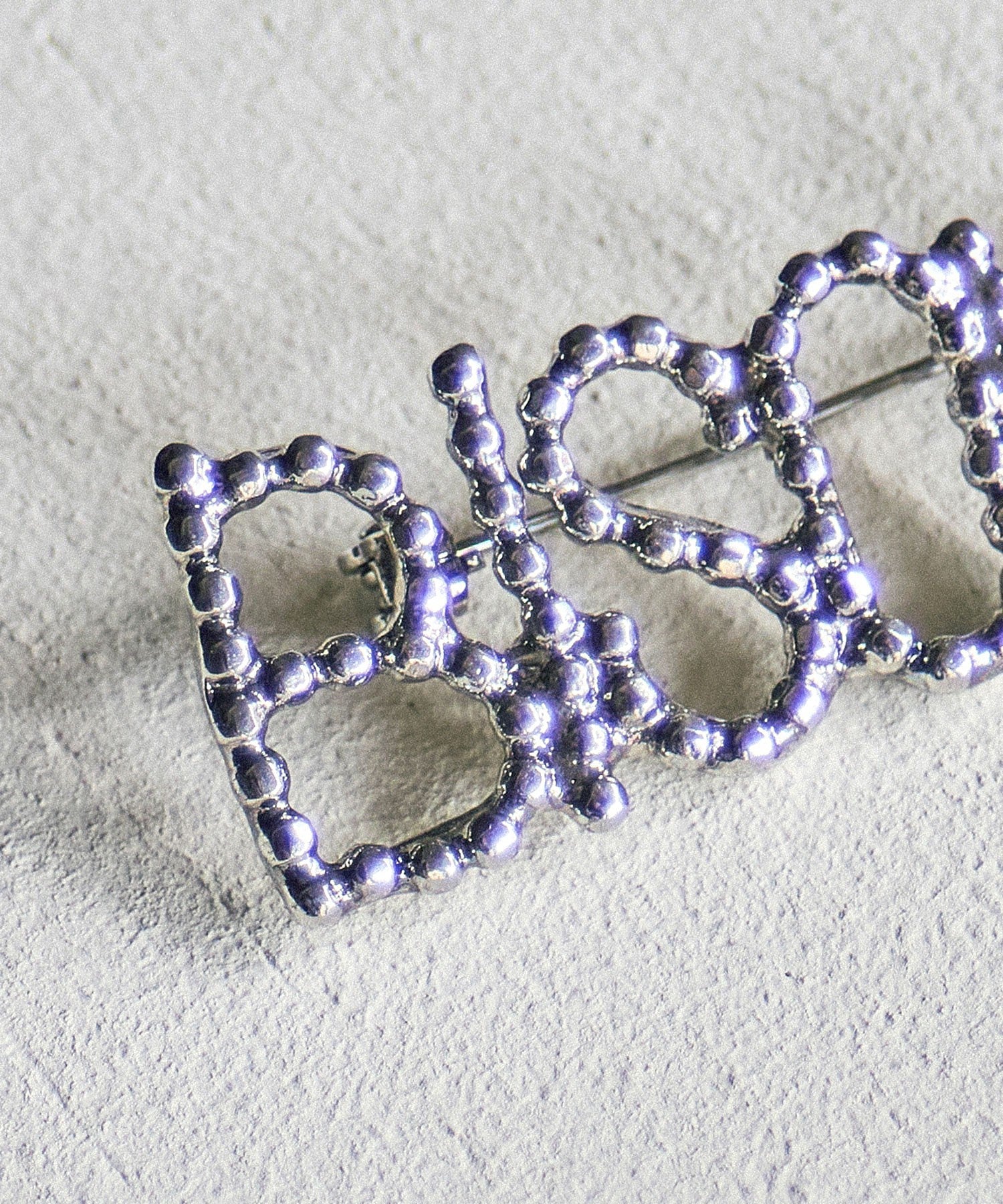 ADER.bijoux/CUTSTEEL BISOUS BROOCH