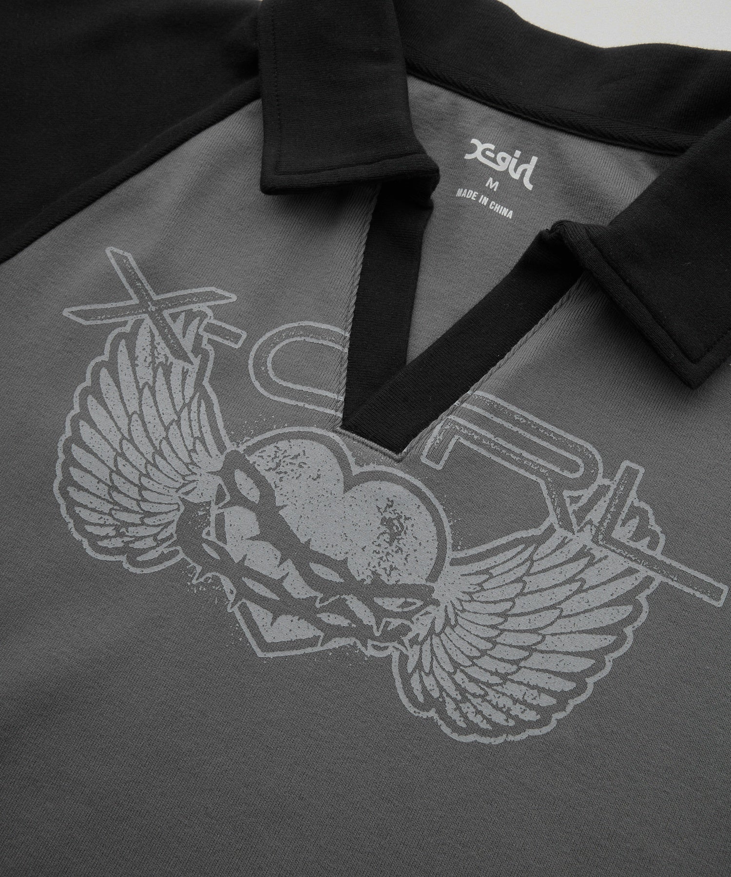 HEART AND WING LOGO RAGLAN POLO TOP
