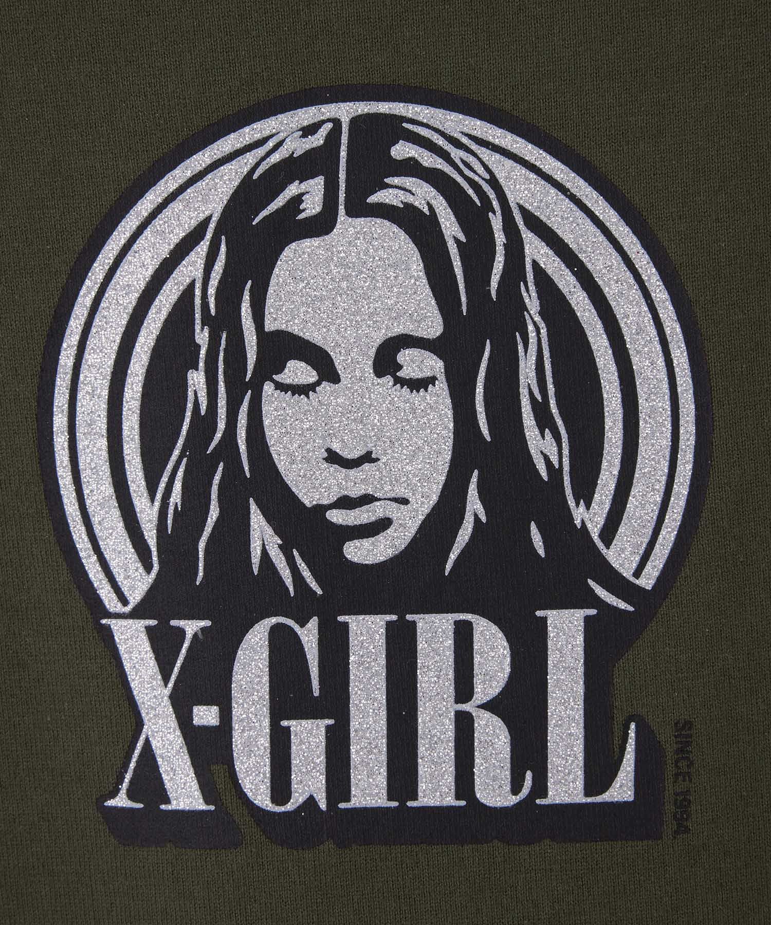 GLITTER CIRCLE BACKGROUND FACE LOGO S/S BABY TEE X-girl