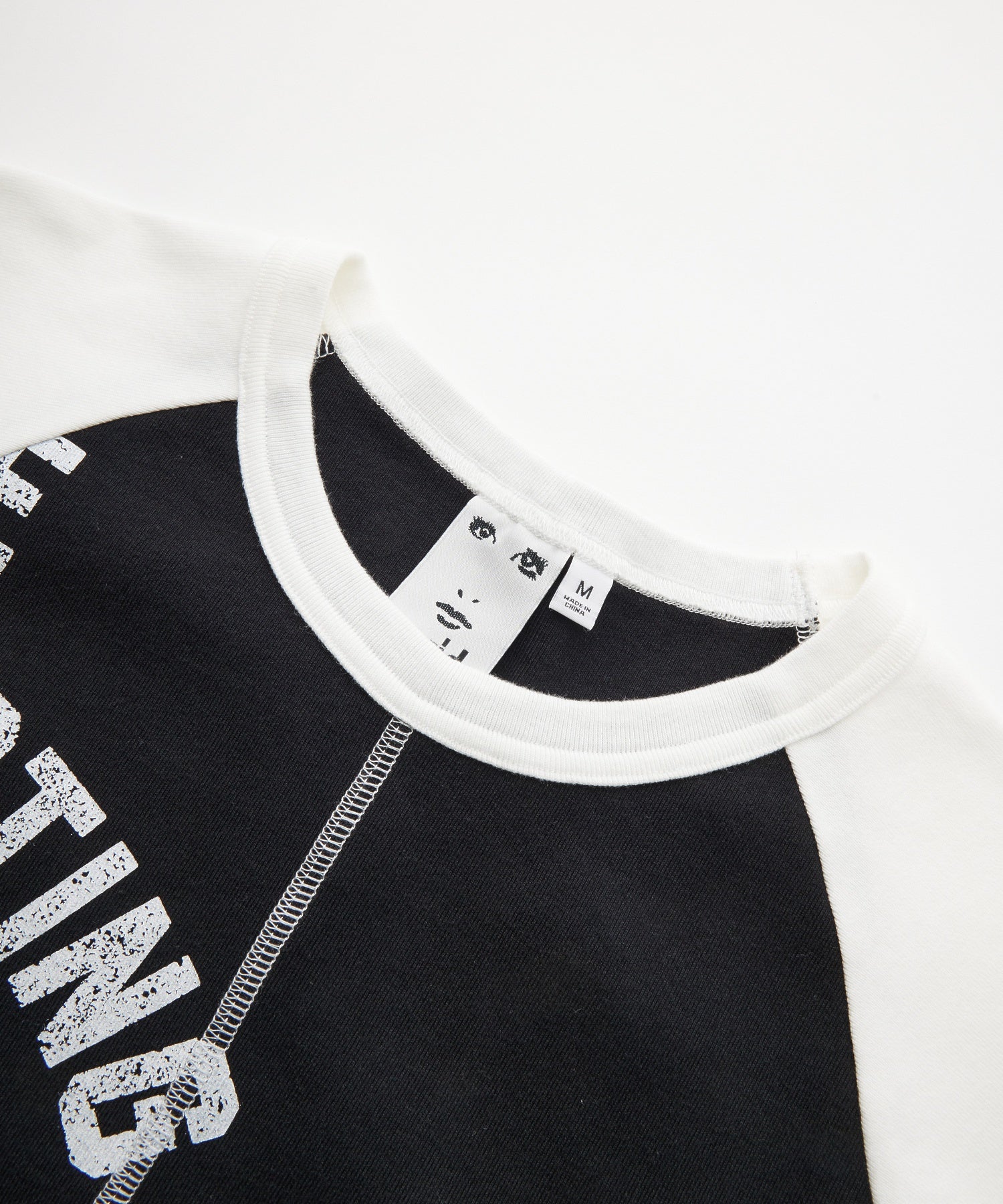 PANELED GRAPHIC RAGLAN BABY TEE