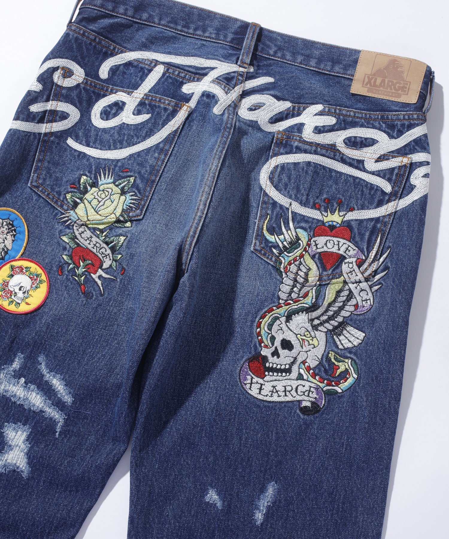 XLARGE×ED HARDY CRASH DENIM PANTS