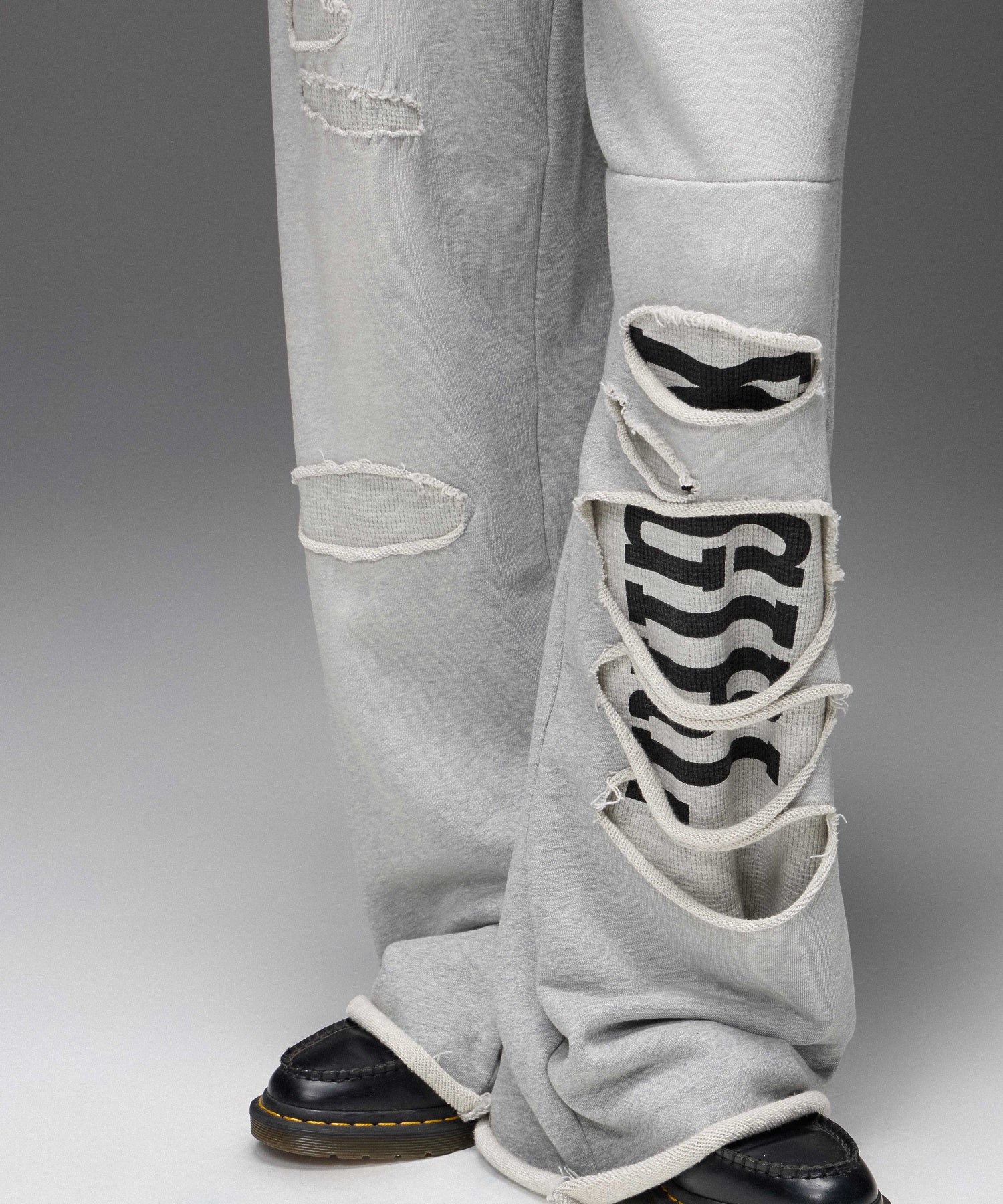 LAYERED DISTRESSED SWEATPANTS