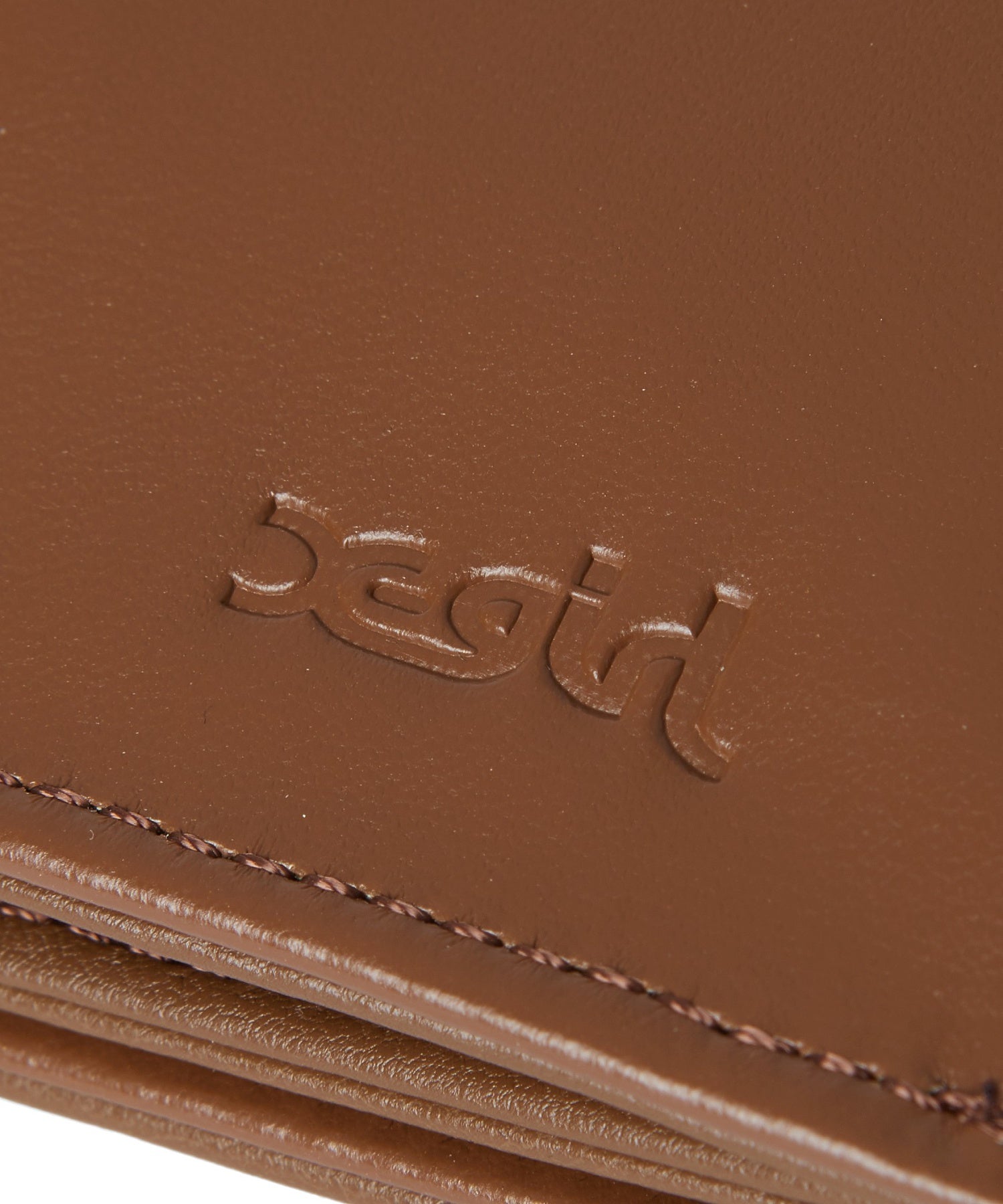 EMBOSSED FACE MINI WALLET