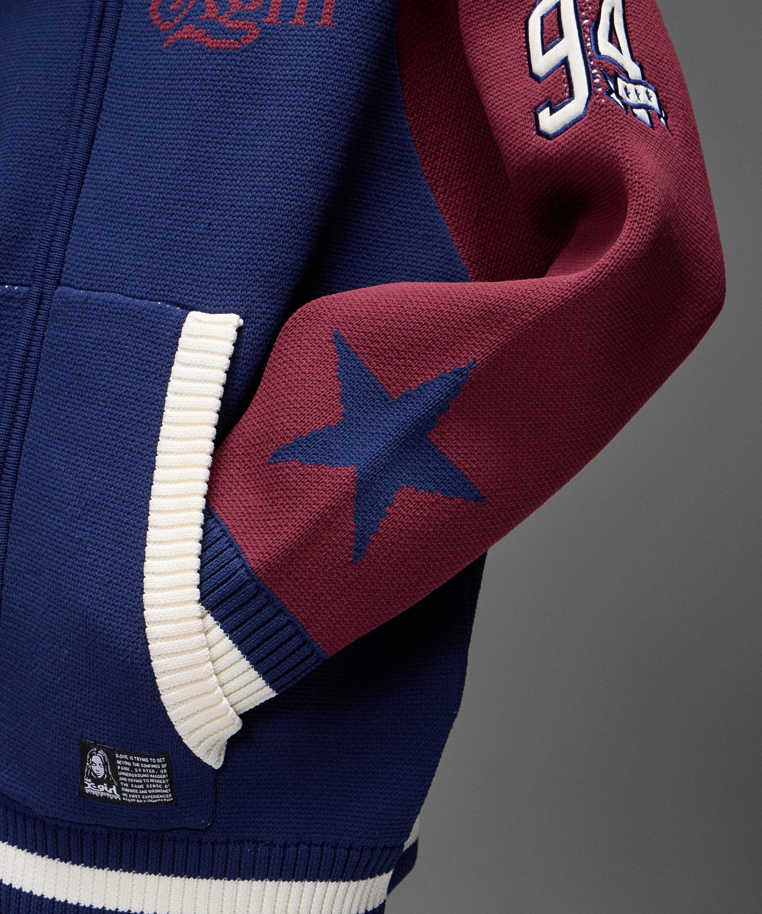 PATCH AND JACQUARD STADIUM KNIT JACKET