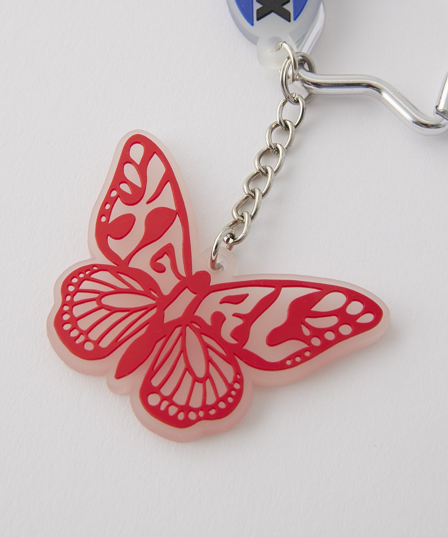 BUTTERFLY AND OVAL LOGO KEY CHARM