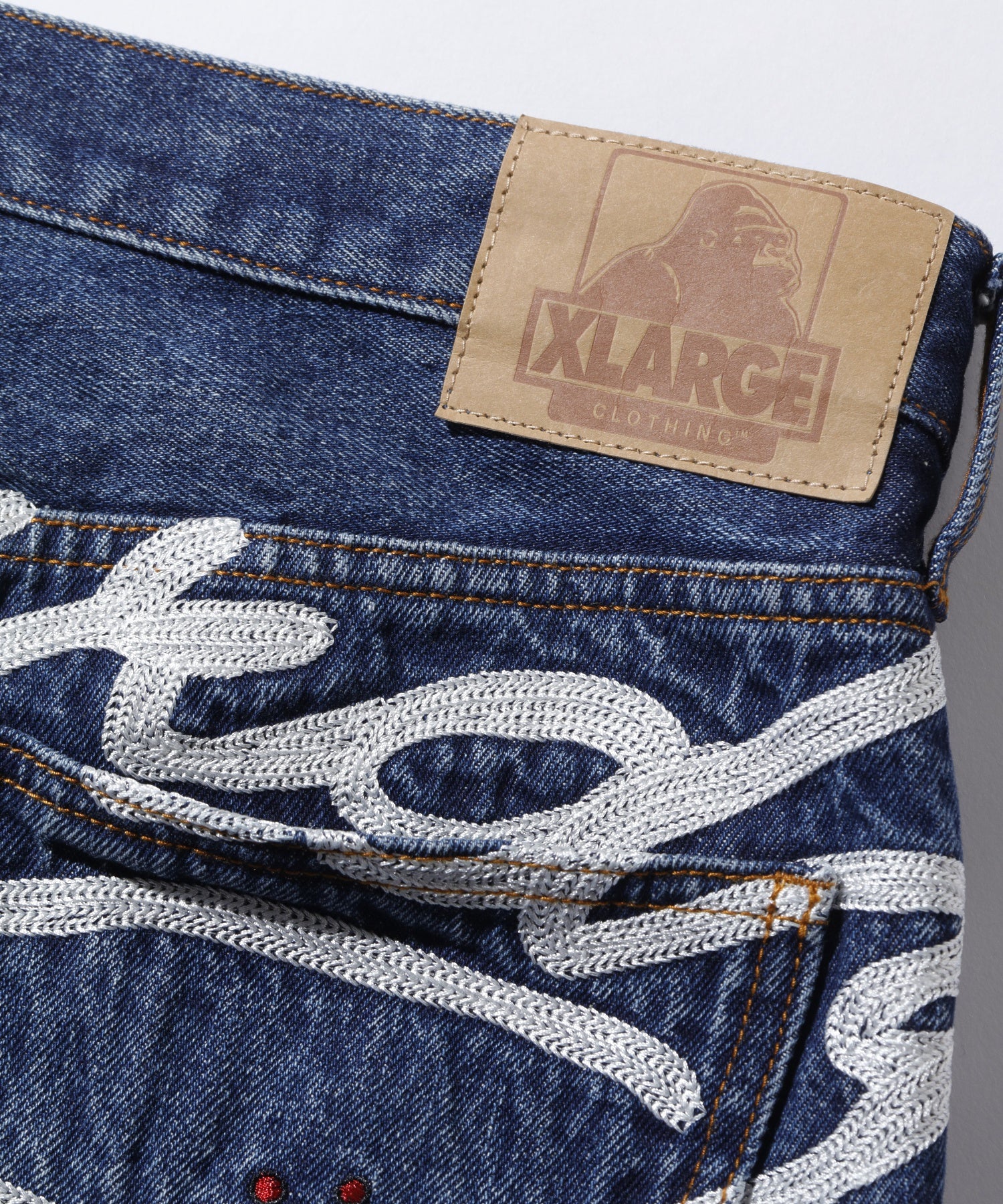 XLARGE×ED HARDY CRASH DENIM PANTS